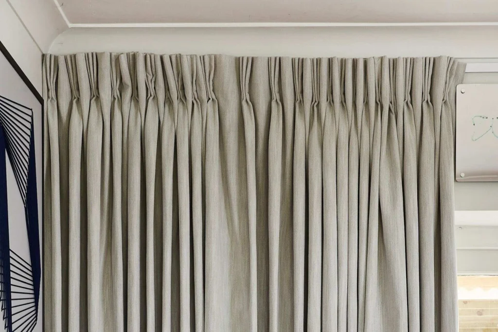 Pinch-Pleat Curtains With Decorative Hardware